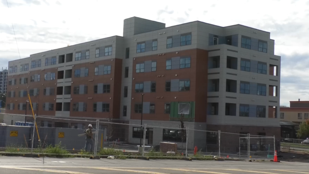 A photo of the East Lake Commons building under construction in downtown Oswego.
