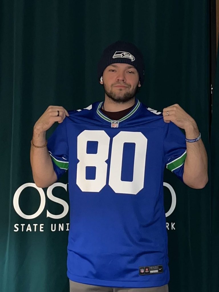 20-year-old Paul Baidy wearing Seattle Seahawks jersey and beanie.
